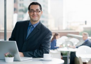 Smiling business man personalizing financial newsletter