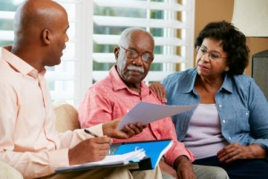 Financial Advisor Talking To Senior Couple about estate planning